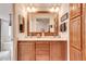 Bathroom with a double sink vanity, granite countertop, and ample cabinet space at 2206 S Ellsworth Rd # 149B, Mesa, AZ 85209