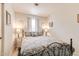Inviting bedroom with an iron bed frame, soft bedding, and decorative lamps at 2206 S Ellsworth Rd # 149B, Mesa, AZ 85209