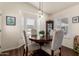 Charming dining area with a round table, comfortable seating, and bright natural light at 2206 S Ellsworth Rd # 149B, Mesa, AZ 85209