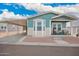 Charming single story home with a covered patio, carport and low maintenance rock landscaping at 2206 S Ellsworth Rd # 149B, Mesa, AZ 85209