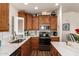 Bright kitchen with stainless steel appliances, light countertops, and wood cabinetry at 2206 S Ellsworth Rd # 149B, Mesa, AZ 85209