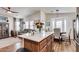 Bright and airy kitchen island that looks into the living room and dining area at 2206 S Ellsworth Rd # 149B, Mesa, AZ 85209
