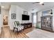 Hardwood floors with fireplace and tv in the living room with a view to the kitchen at 2206 S Ellsworth Rd # 149B, Mesa, AZ 85209