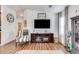 Well-lit living room featuring wood flooring, modern furnishings, and neutral color scheme at 2206 S Ellsworth Rd # 149B, Mesa, AZ 85209