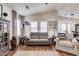 Inviting living room with plush seating, hardwood floors, and natural light at 2206 S Ellsworth Rd # 149B, Mesa, AZ 85209