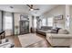 Bright living room features hardwood floors, cozy furniture, and plenty of natural light at 2206 S Ellsworth Rd # 149B, Mesa, AZ 85209