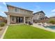 Expansive backyard with covered patio, pool, spa, artificial turf, and outdoor seating for entertaining at 25582 S 224Th Way, Queen Creek, AZ 85142