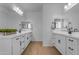 Spacious bathroom with double vanities, white cabinets, and modern fixtures at 25582 S 224Th Way, Queen Creek, AZ 85142