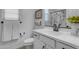 Clean bathroom featuring a white vanity, toilet, decorative sign, and shower with patterned curtain at 25582 S 224Th Way, Queen Creek, AZ 85142