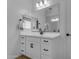 Contemporary bathroom featuring a sleek vanity with a modern mirror and stylish fixtures at 25582 S 224Th Way, Queen Creek, AZ 85142