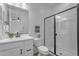 Modern bathroom featuring a sleek glass-enclosed shower, white cabinets, and contemporary fixtures at 25582 S 224Th Way, Queen Creek, AZ 85142