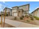 Attractive two-story home featuring a well-manicured front yard and a welcoming stone accented entryway at 25582 S 224Th Way, Queen Creek, AZ 85142