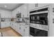 Well-equipped kitchen with stainless steel appliances and modern white cabinetry at 25582 S 224Th Way, Queen Creek, AZ 85142