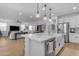 Bright kitchen featuring an island with pendant lighting, stainless steel appliances, and a farmhouse sink at 25582 S 224Th Way, Queen Creek, AZ 85142