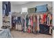 Well-organized walk-in closet with ample storage for clothing, shoes, and accessories at 25582 S 224Th Way, Queen Creek, AZ 85142