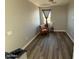 Bright bedroom features hardwood floors, neutral walls, and a large window at 2821 S Skyline Dr # 134, Mesa, AZ 85212