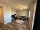 Comfortable living room features hardwood floors, neutral walls, and a ceiling fan at 2821 S Skyline Dr # 134, Mesa, AZ 85212