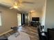 Bright living room features a sliding glass door, hardwood floors, and ceiling fan at 2821 S Skyline Dr # 134, Mesa, AZ 85212