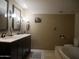 Bathroom showcasing a double sink vanity with updated fixtures, and a separate soaking tub at 3030 N Hayden Rd # 28, Scottsdale, AZ 85251