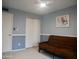 Neutral-toned bedroom with white trim, a futon, an accent wall, and a fan at 3030 N Hayden Rd # 28, Scottsdale, AZ 85251