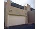 Exterior view of the home featuring a one car garage with a modern design and well-maintained facade at 3030 N Hayden Rd # 28, Scottsdale, AZ 85251