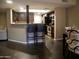 Stylish kitchen featuring dark cabinets, granite countertops, stainless steel appliances, and a breakfast bar at 3030 N Hayden Rd # 28, Scottsdale, AZ 85251