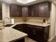 Updated kitchen featuring granite countertops, ample cabinet space, and modern fixtures at 3030 N Hayden Rd # 28, Scottsdale, AZ 85251