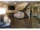 Open-concept living room with slate stairs, a modern ceiling fan, and a comfortable seating area at 3030 N Hayden Rd # 28, Scottsdale, AZ 85251