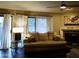 Inviting living room with a fireplace, modern decor, large windows, and comfortable seating at 3030 N Hayden Rd # 28, Scottsdale, AZ 85251