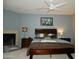 This inviting main bedroom features a ceiling fan, and a dark wood bedroom set at 3030 N Hayden Rd # 28, Scottsdale, AZ 85251