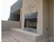 View of an outdoor fireplace on the patio at 3030 N Hayden Rd # 28, Scottsdale, AZ 85251