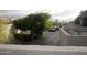 View of a parking lot surrounded by mature trees, and buildings at 3030 N Hayden Rd # 28, Scottsdale, AZ 85251
