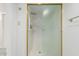 Bathroom showcasing the white tiled shower stall with a frosted glass sliding door at 3800 E Lincoln Dr # 7, Phoenix, AZ 85018