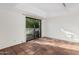 Bedroom featuring a large sliding glass door, and terracotta tile floors at 3800 E Lincoln Dr # 7, Phoenix, AZ 85018