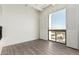 Bright bedroom with hardwood floors and large window with elegant shutters with a view at 3800 E Lincoln Dr # 7, Phoenix, AZ 85018