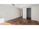 Bedroom showing terracotta tiled floors and views into the hallway at 3800 E Lincoln Dr # 7, Phoenix, AZ 85018