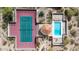 Birds eye view of a sparkling community pool and tennis court in a desert landscaped community at 3800 E Lincoln Dr # 7, Phoenix, AZ 85018