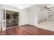Cozy living area with hardwood floors, stairs, and a patio at 3800 E Lincoln Dr # 7, Phoenix, AZ 85018