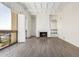 Bright living room with a fireplace, hardwood floors, and access to an outside view at 3800 E Lincoln Dr # 7, Phoenix, AZ 85018