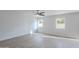Bright bedroom features light wood floors, a ceiling fan, and plenty of natural light from the two windows at 3917 E Morenci Rd, San Tan Valley, AZ 85143