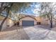 Charming two-story home featuring desert landscaping and a spacious driveway leading to a gray garage door at 3917 E Morenci Rd, San Tan Valley, AZ 85143