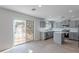 Modern kitchen featuring gray cabinets, stainless steel appliances, and a sliding door leading to the backyard at 3917 E Morenci Rd, San Tan Valley, AZ 85143