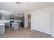 Contemporary kitchen features gray cabinetry, stainless steel appliances, and an island with a white countertop at 3917 E Morenci Rd, San Tan Valley, AZ 85143