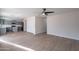 Open-concept space featuring a contemporary kitchen connected to a spacious living room with wood-look flooring at 3917 E Morenci Rd, San Tan Valley, AZ 85143