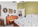 Well lit bedroom featuring a piano and washer dryer at 4013 E Woodland Dr, Phoenix, AZ 85048