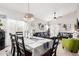 Spacious dining room featuring a decorative chandelier, connecting to the living room at 4013 E Woodland Dr, Phoenix, AZ 85048