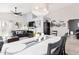 Elegant dining area with a large chandelier, seamlessly integrated into the open-concept living space at 4013 E Woodland Dr, Phoenix, AZ 85048