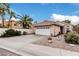 Charming home featuring a two-car garage, tiled roof and low maintenance desert landscaping at 4013 E Woodland Dr, Phoenix, AZ 85048