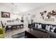 Open-concept living room with a dining area and large sofa, filled with lots of natural light at 4013 E Woodland Dr, Phoenix, AZ 85048