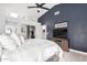 This main bedroom has a tv, sliding door closet, skylight, and a contemporary style at 4013 E Woodland Dr, Phoenix, AZ 85048